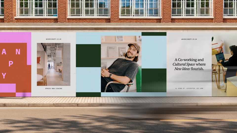 Canopy construction hoarding featuring photographs of the workspace and people