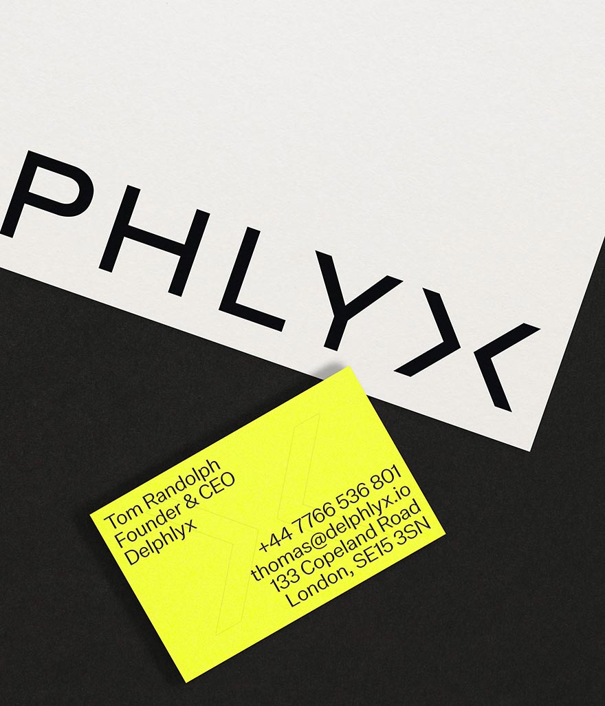 Printed stationery design showing a business card and comliment slip with Delphlyx logo
