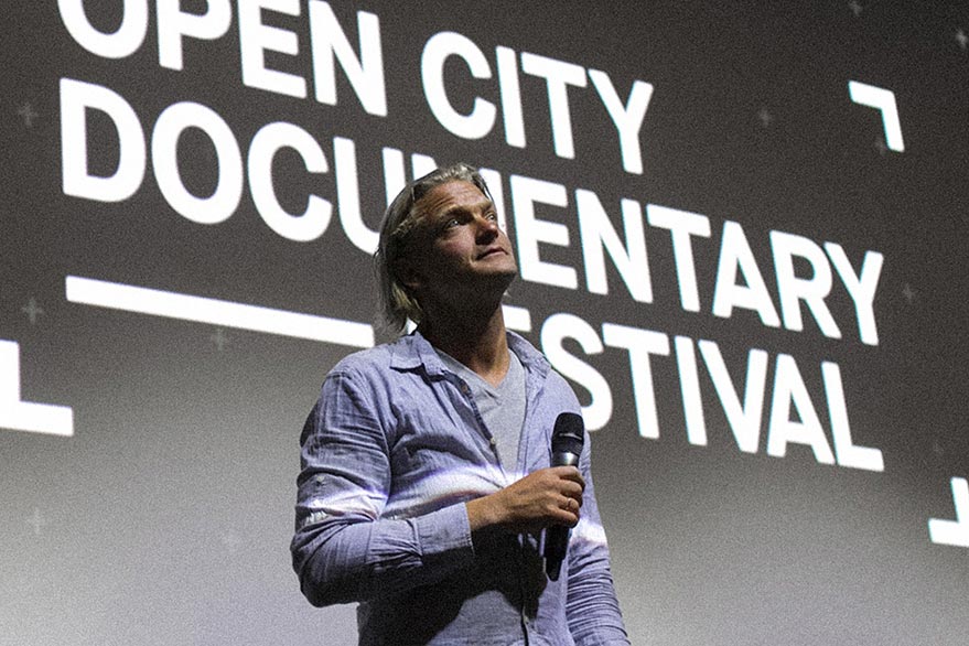 Speaker on stage at Open City Documentary Festival in London